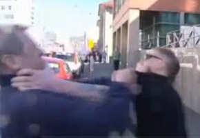 Cameraman tackles man outside court